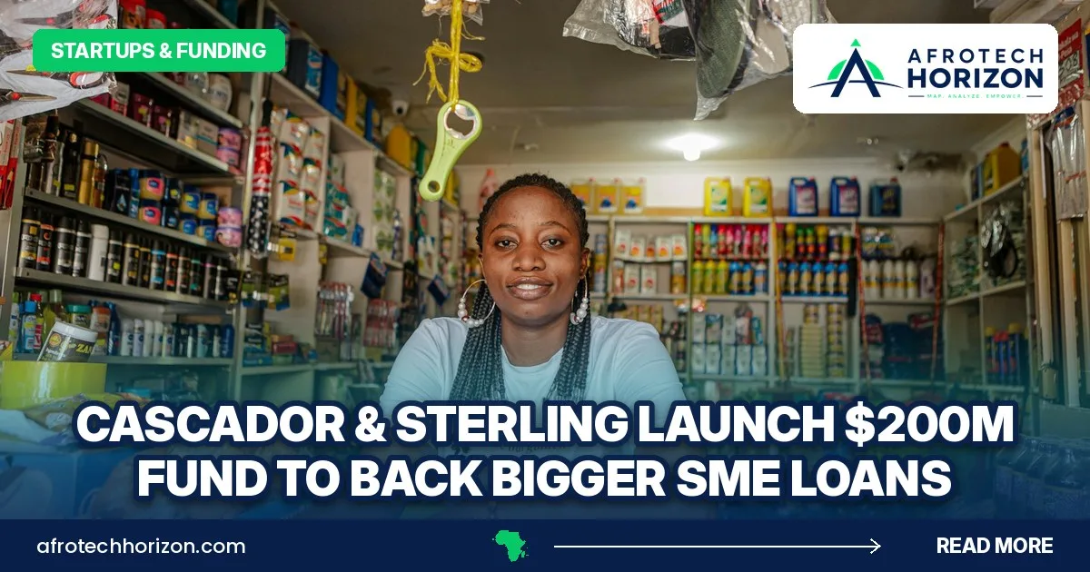 A shopkeeper smiles from behind the counter of a small, well-stocked general store.