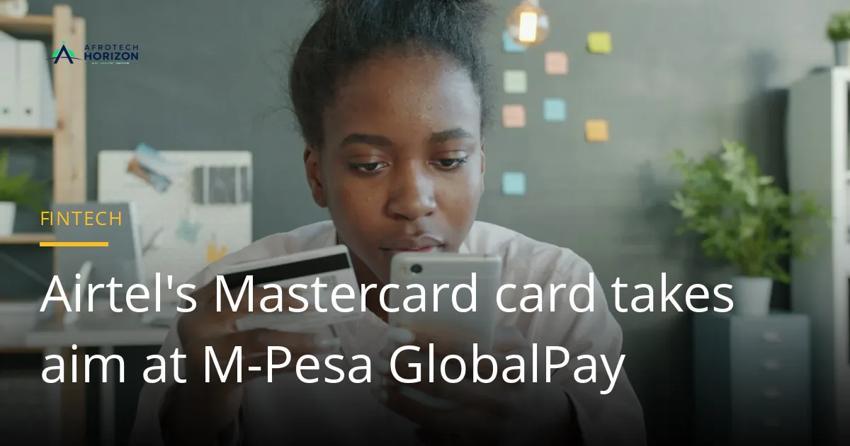 A young woman holds a bank card in one hand and a smartphone in the other while paying online
