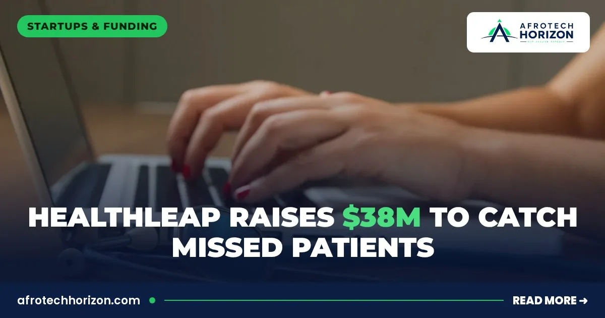 Hands typing on a laptop beside a stethoscope on a desk
